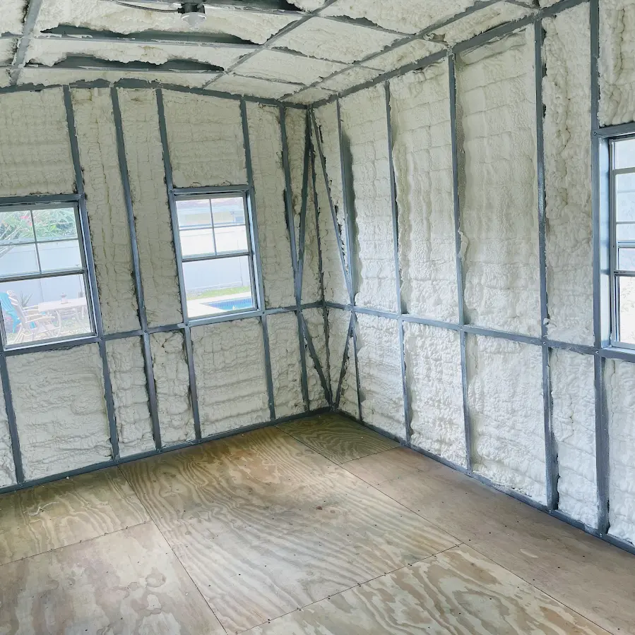 Closed-cell spray foam insulation applied to wall cavities in a residential project in Webster